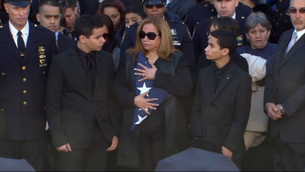Rafael Ramos family with flag