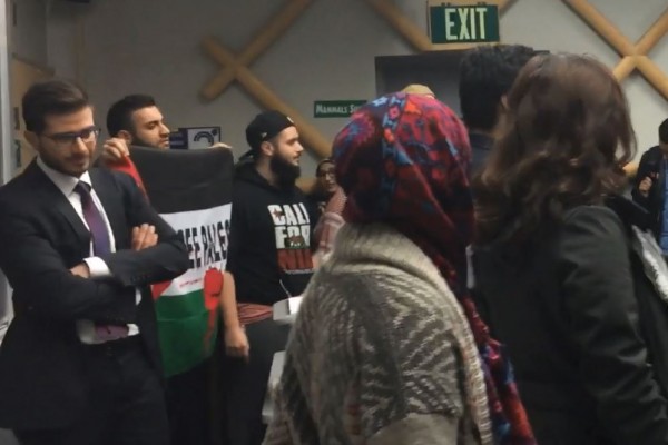 UC Davis SJP Shout Down Israeli Arab Diplomat George Deek behind protesters